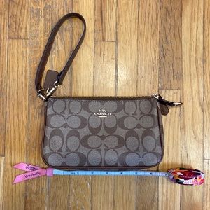 As is Coach outlet wristlet.